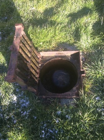 Lifted inspection chamber in a grassy SuDS basin