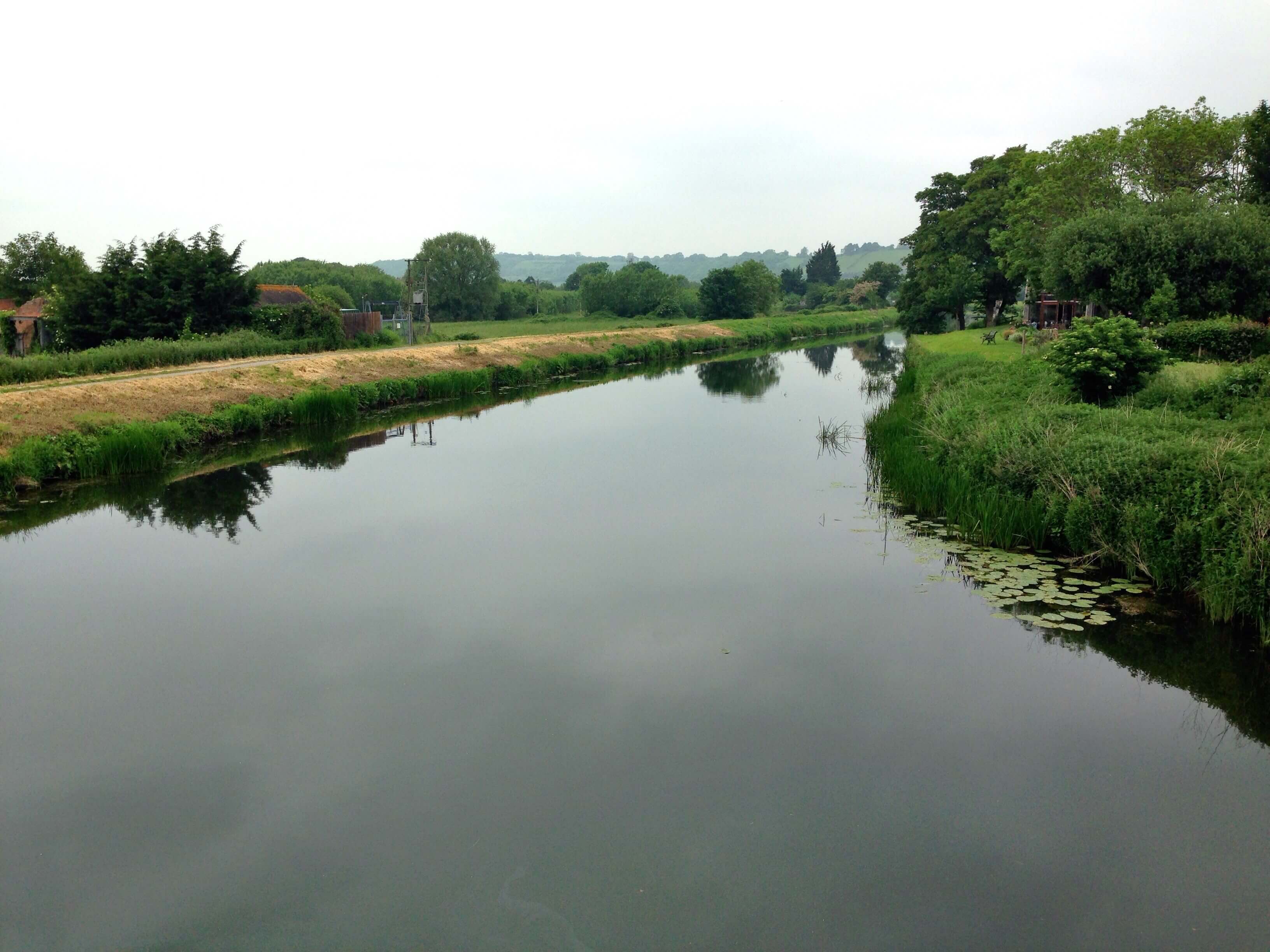 Wide river with grassy banks in the Somerset Levels